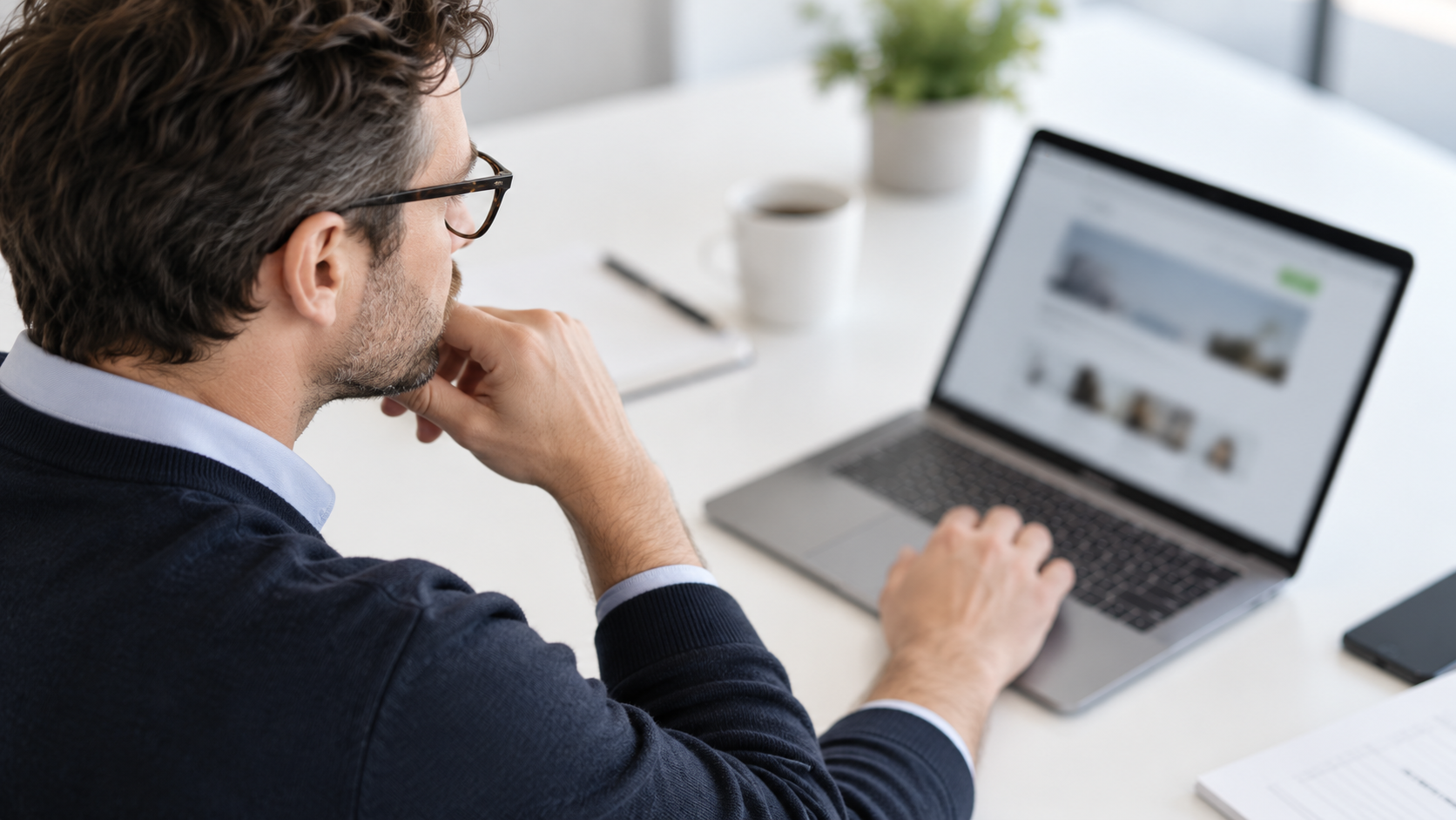Focused professional working strategically on a laptop